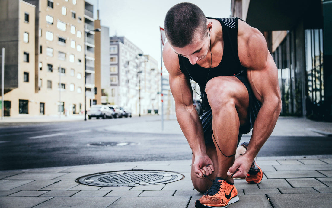 Man tying his shoe laces 